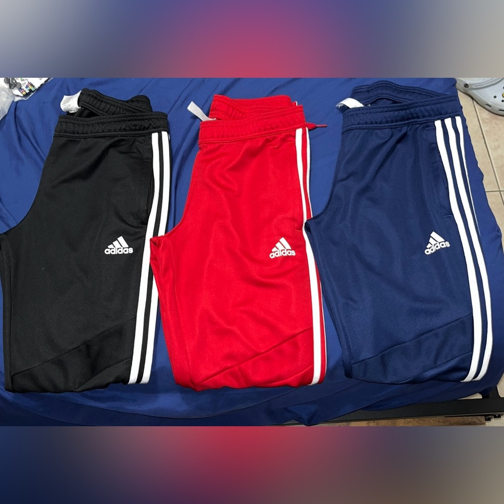 Men’s Adidas Pants: Size Small: Black, Red, and Blue with white stripes.